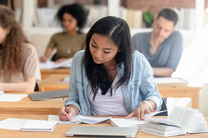 Girl taking an exam for her bachelor's degree