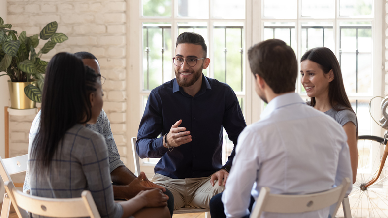 A life coach talking to a group