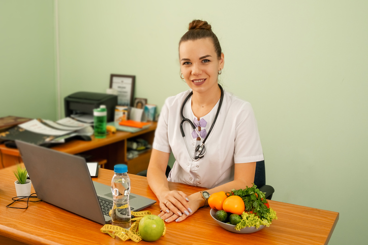 Nutritionist sitting at her desk in a college office