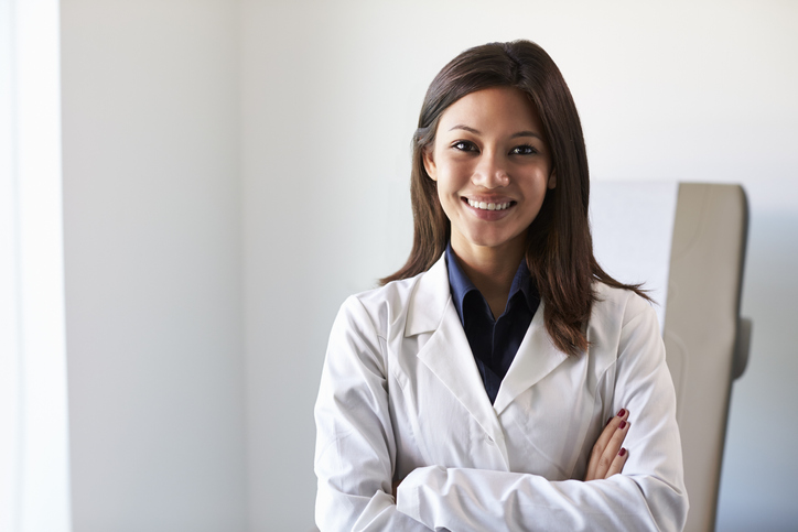 Woman technician standing in her lab coat