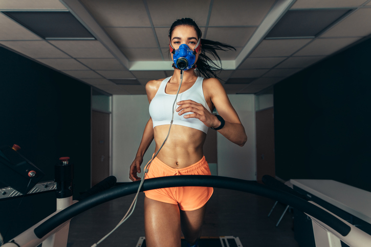 female athlete running on a treadmill