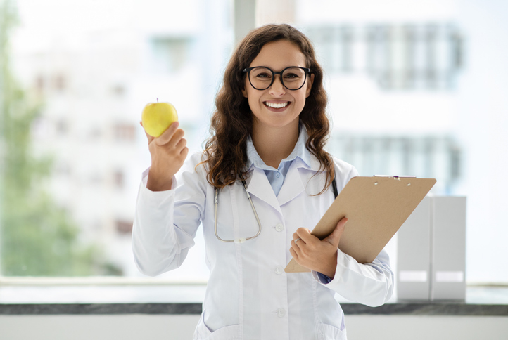 Young dietitian working in her office